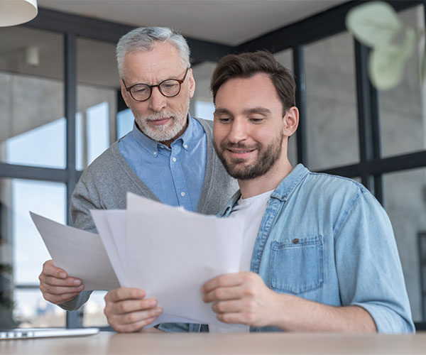 father helping his son with this documents