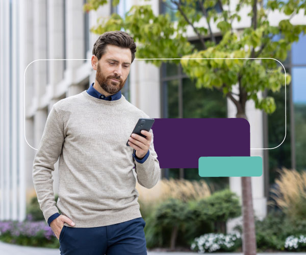 A person checking their savings account on a mobile banking app in the UAE.