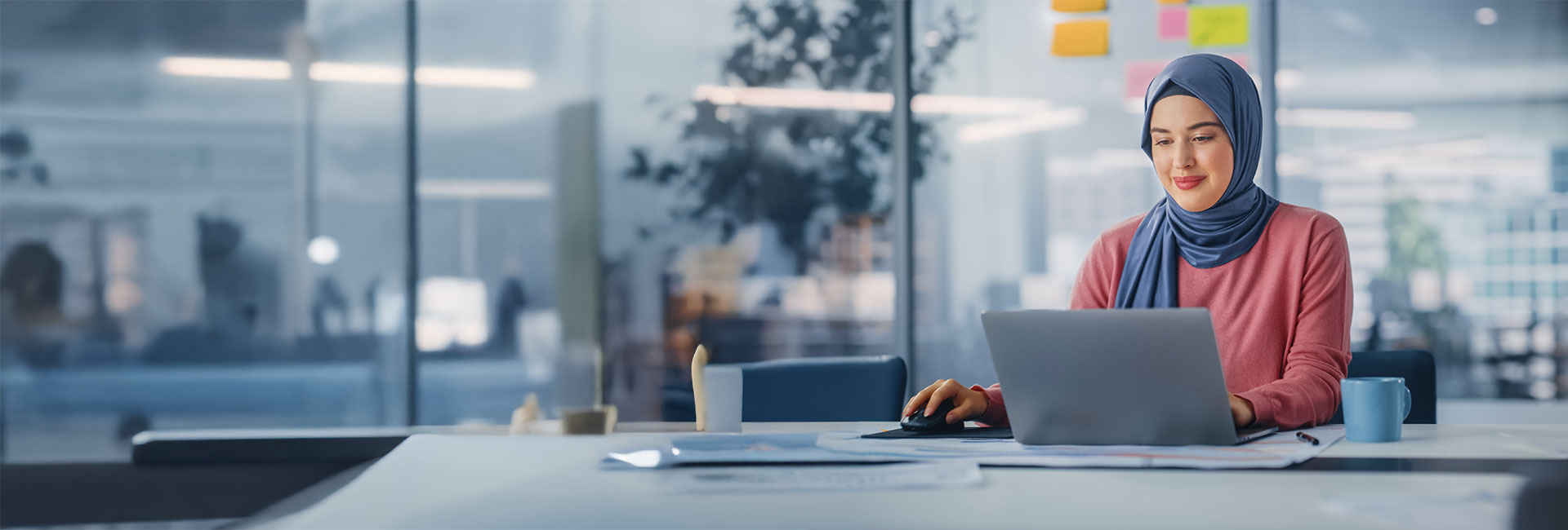 young muslim businesswoman using a laptop