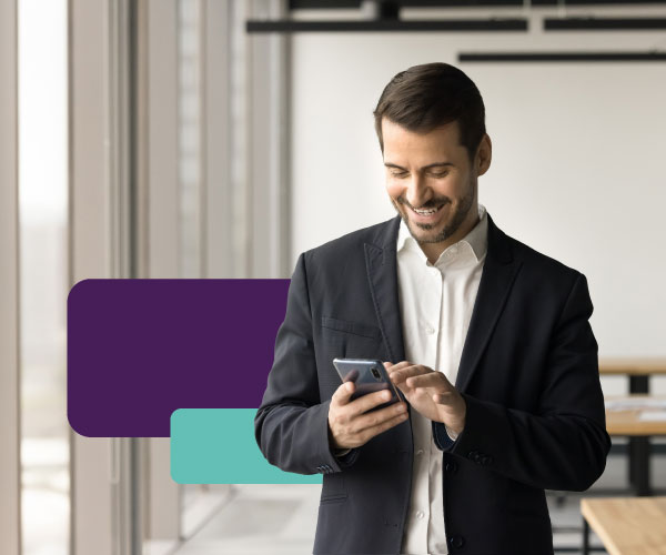 A person reviewing their bank account on a mobile phone in an office.
