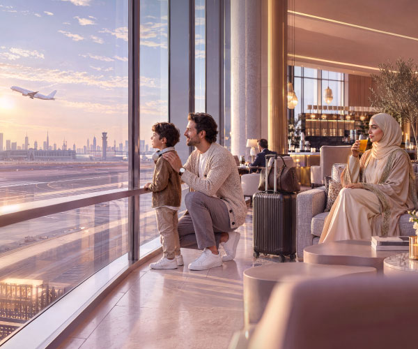 Premium airport lounge experience with travellers enjoying luxury travel benefits and runway views.